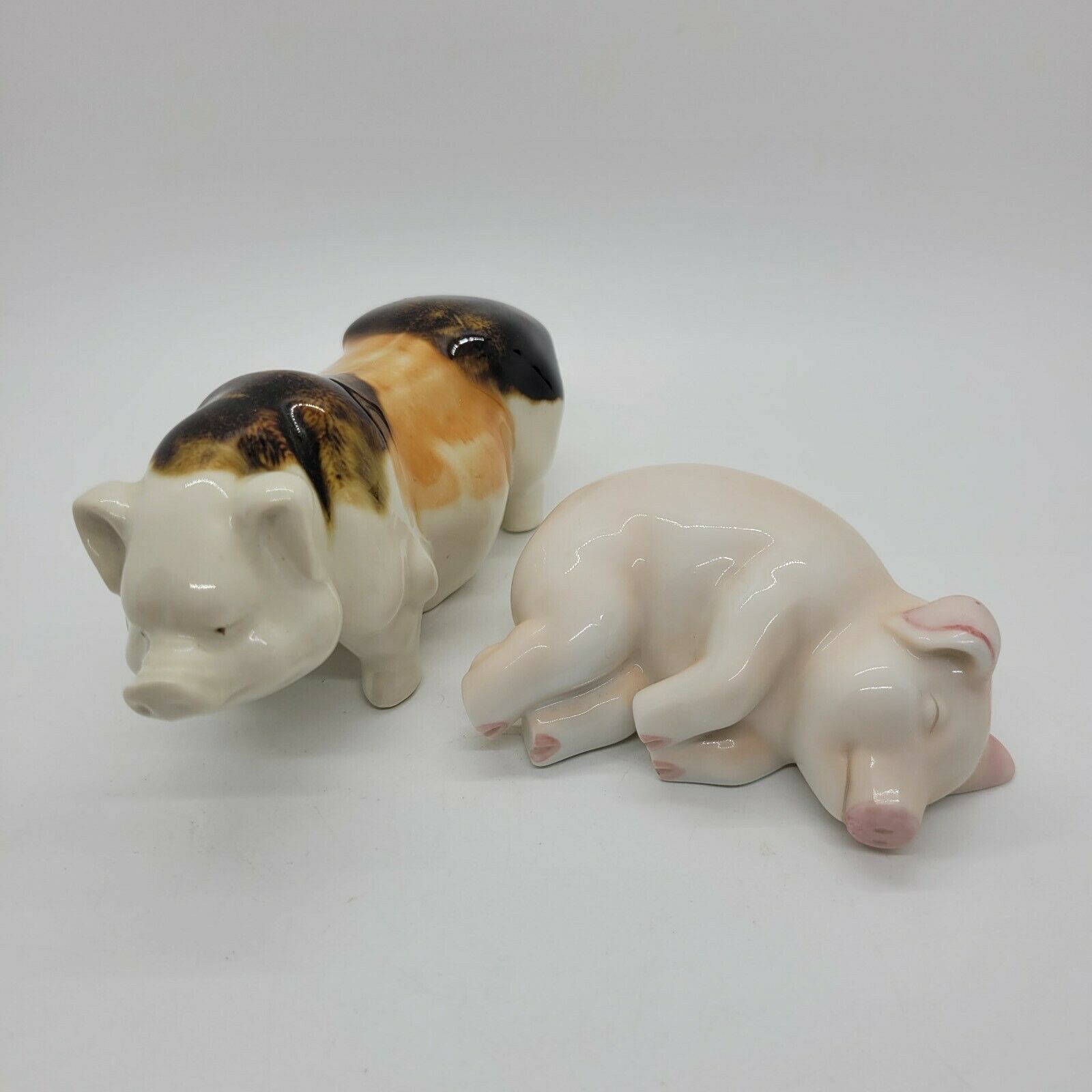 Two Ceramic Miniature Pig Figurines